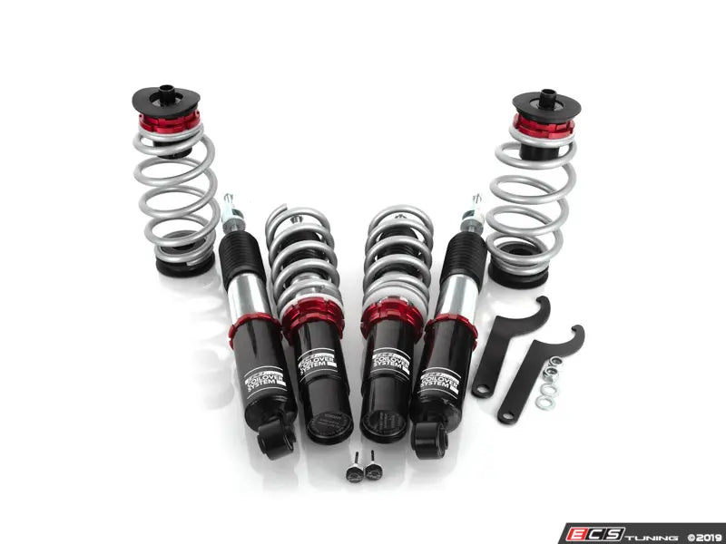 Set of suspension components on a white background with ECS Tuning branding.