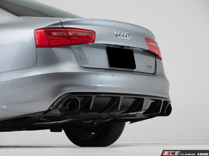 Audi car rear end with visible Audi logo on a white background