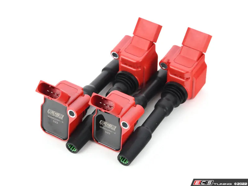 Red ignition coils with black connectors on a white background
