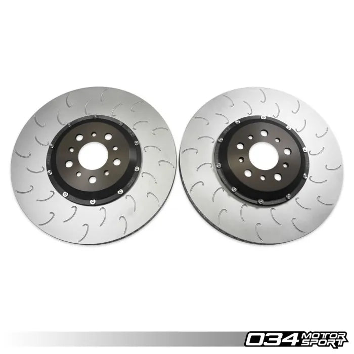 Two brake rotors on a white background with '034 Motor Sport' branding.