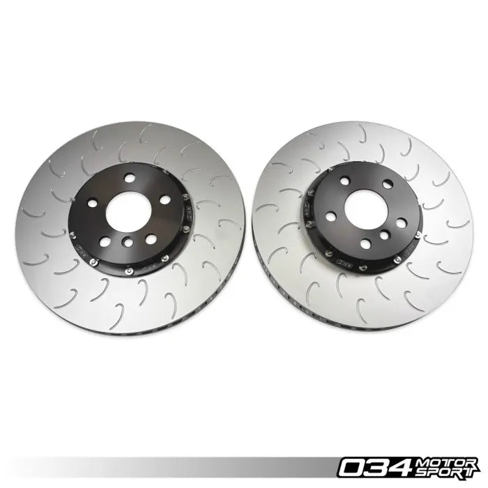 Two brake rotors on a white background with '034 Motor Sport' branding.