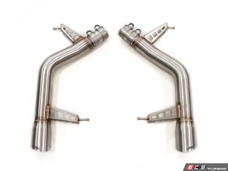 Two stainless steel exhaust pipes on a white background