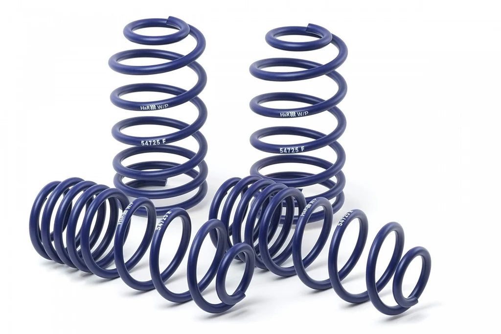 Two sets of H&R blue springs on a white background