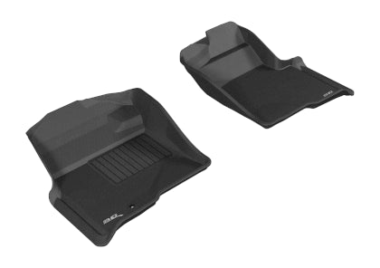 Two black car floor mats on a white background