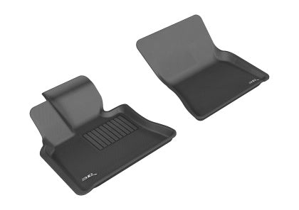 Two black car floor mats with a brand logo on a white background