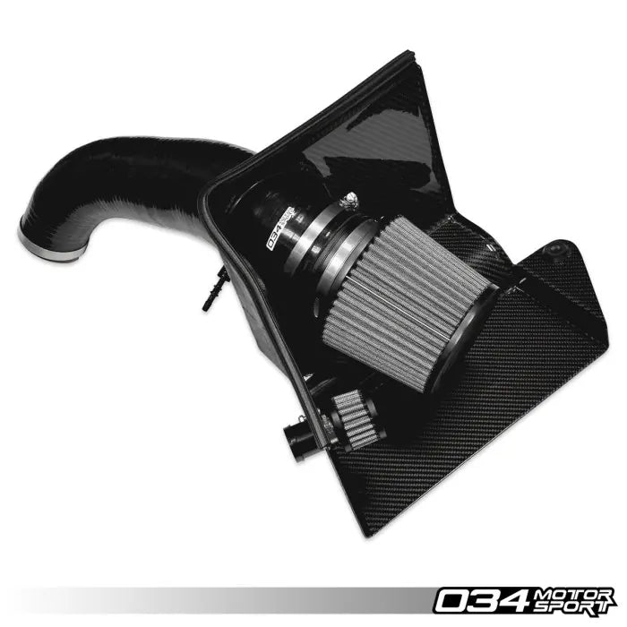 Black car air intake system with carbon fiber cover on a white background, branded '034 Motor Sport'.