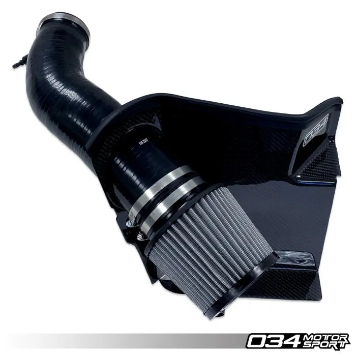 Car air intake system with black silicone hose and gray filter on a white background, featuring 034 Motorsport branding.